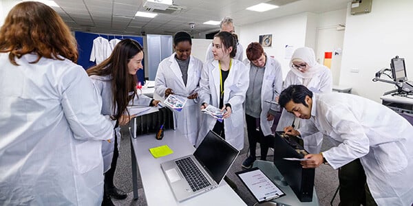 Lab team at computer